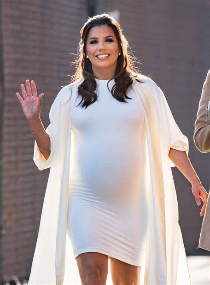Pals: Eva Longoria was seen spending time with tennis legend Serena Williams as they stood on the balcony during the lavish nuptials
